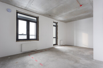 interior of the apartment without decoration in gray colors. rough finish