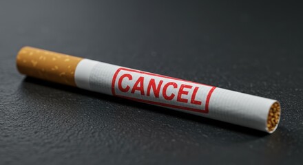 Obraz premium Close up of a cigarette with a red CANCEL stamp, symbolizing quitting smoking and breaking the addiction.