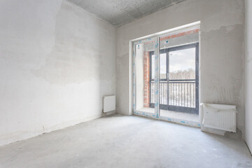 interior of the apartment without decoration in gray colors. rough finish