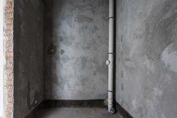 interior of the apartment without decoration in gray colors. rough finish