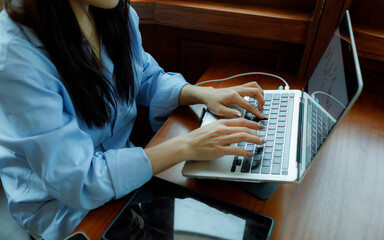 A female investor analyzes past trends, sets goals, diversifies assets, and manages risks to ensure...