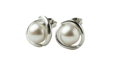 Two pearl earrings with silver wrapping are captured closely