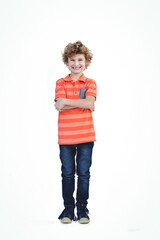 Smiling boy in striped shirt standing confidently with arms crossed