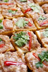 Minced pork toast texture background. Vertical food texture of minced pork toast with chilli. Preparing food, Thai recipe, menu, eating, deep-fried food, and home cooking concepts for food background.