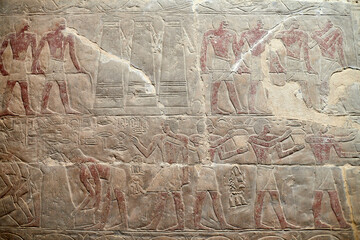 An offering procession from the tomb of Mereruka and grain silo: A colourful wall carving from the...