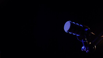 Studio microphone with dramatic blue lighting