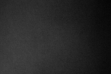 Black paper surface with grainy texture