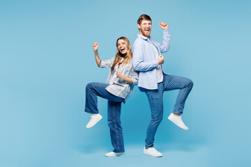 Full body young couple two friends family man woman wear shirt casual clothes together doing winner...