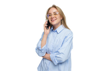 Young woman with glasses smiles while talking on the phone in a bright setting indoors