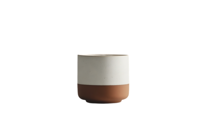 Two toned ceramic cup is centered on a black background