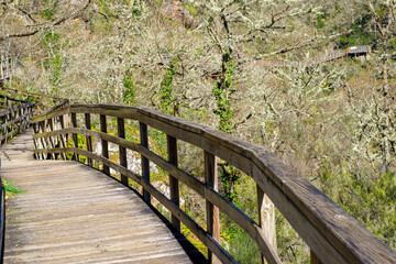 wooden footbridge on the river Mao, hiking route in Ribeira Sacra