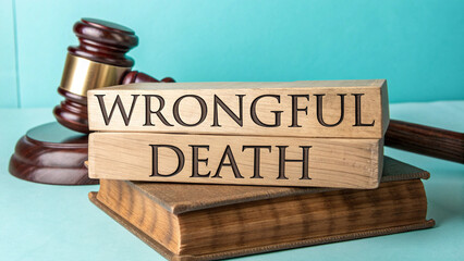 wooden gavel, legal concept, "wrongful death" text, old book, teal background, legal justice theme, dramatic lighting, high contrast, studio photography, close-up detail