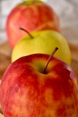 Ripe juicy apples on a white tablecloth