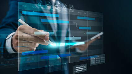 Business project management and timeline scheduling. A professional analyzing Gantt charts and...