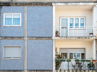 Close-up of traditional ceramic tile covered facades of residential apartment buildings in Braga in Portugal