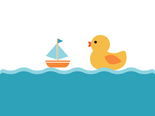 水に浮かぶアヒルのおもちゃとヨット