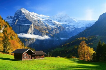 Obraz premium Majestic mountain landscape with a charming wooden cabin surrounded by vibrant fall foliage at sunrise in the Swiss Alps