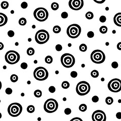 Seamless black and white pattern of hand-drawn marker centric circles, balls and dots
