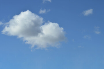 Simple Cloud on a Light Blue Background – Clean Sky Image for Website Banners, Posters, Advertising, or Meditation and Wellness Branding