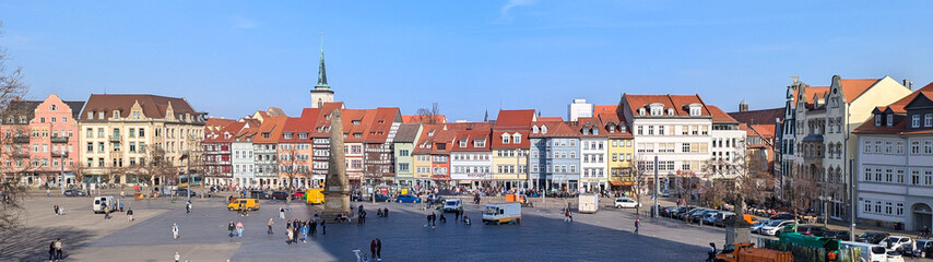 Naklejka premium Beautiful facades of historic buildings against the blue sky on a sunny day.