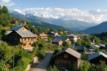 Rural town houses nestled in mountain valley under cloudy skies for travel blogs