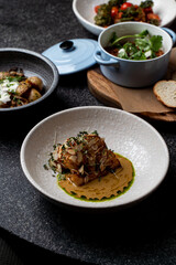 A delectable array of European dishes showcases culinary artistry with vibrant colors and textures. Diners enjoy an inviting atmosphere enhanced by exquisite flavors and fresh ingredients