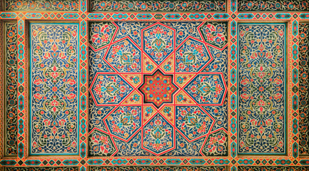 Wooden ceiling, national ornaments from Uzbekistan, mosaic red, green and orange asian background
