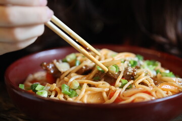 Asian-style meal preparation, casual dining setting.