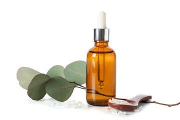 Cosmetic oil bottle with eucalyptus branch, wooden spoon and sea salt on white background