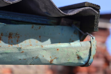 A detailed view of an old rusty metal part.