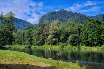 The Dunajec River near the blue sky of the town of Szczawnica.