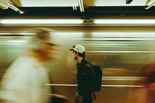 Urban solitude amidst daily hustle in a subway station in New York