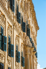 View of old building with windows, balconies in city. Republic of Malta, the picturesque city of...