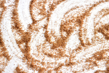 Roasted ground coffee ready to drink lies on a white background. Close-up.