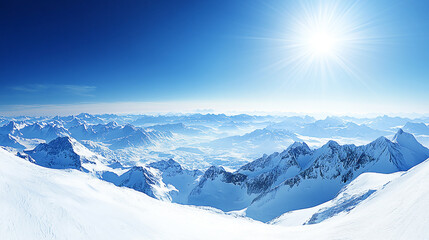 Fototapeta premium Snow-covered mountain landscape under a bright blue sky with the sun shining above