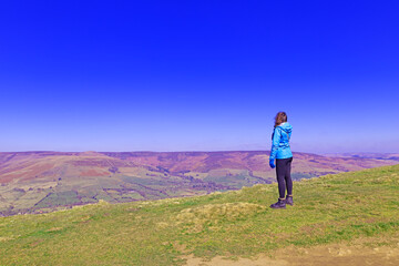 Young woman walking in the mountains.