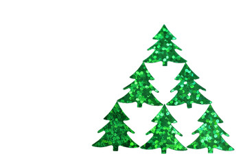 Decorative paper ornament in the form of shiny Christmas trees on a white background.