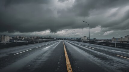 Fototapeta premium Endless road disappearing into the horizon under clear blue sky.