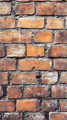 Obraz premium Close-up of rustic red brick wall with weathered texture