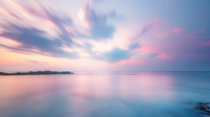 Naklejka premium Calm Sunrise with Soft Clouds Over the Sea.