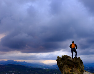 Storm clouds and bad weather. Man in front of bad weather with very cloudy skies.