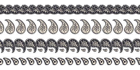 Seamless borders set with black and white paisley floral pattern. Intricate eastern vintage background. Bohemian monochrome textile design.