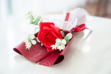 Valentine's day concept, bouquet of red and pink roses Put on the table food lunch In a restaurant background