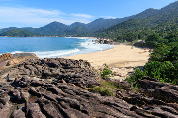 Lava rock leading to a tropical beach