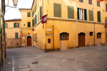 The architecture and narrow streets of the city of Siena in Italy