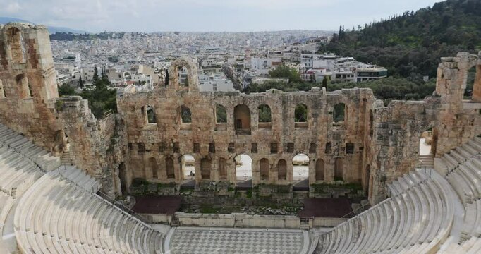 Top view panorama of the ancient Odeon Herodes Atticus (Herodeion) stone Roman theatre forum on Acropolis hill in Athens, Greece