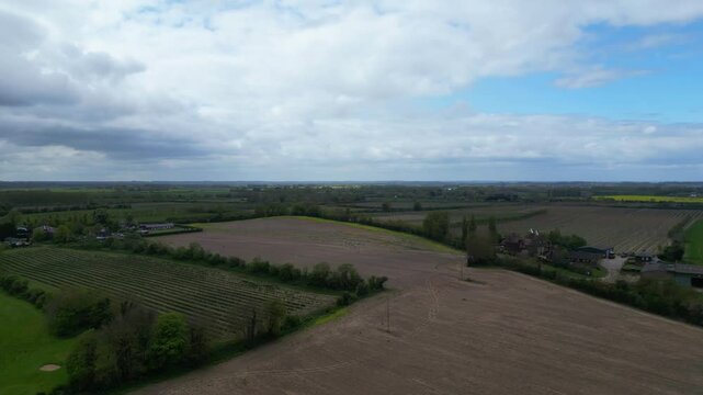 High Angle British Agricultural Farms at Gorgeous Countryside Landscape of England Great Britain of United Kingdom. Footage Was Captured with Drone's Camera from Medium High Altitude