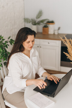 Nutritionist working in a cozy home office with a laptop