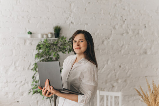 Nutritionist Working with Laptop in a Modern Office Setting