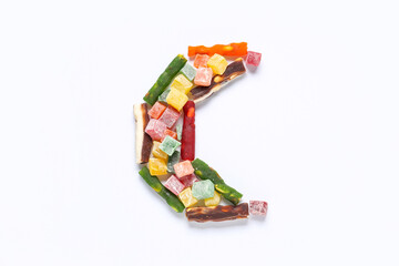 Crescent made of tasty Eastern sweets on white background. Ramadan celebration